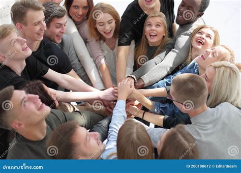 Group Of Diverse People Joining Their Hands In A Circle Stock Photo