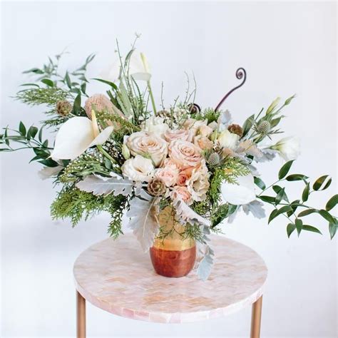 Let the flower shop florist wellington team handle the funeral flower arrangements for you. Succulent Shebang (With images) | Wedding table ...