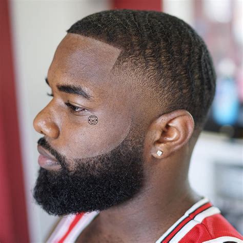 This cool cut for black hair extends the hairline into an arced part that also divides long hair from short. 31+ Trendy Haircuts & Hairstyles for Black Men - Sensod
