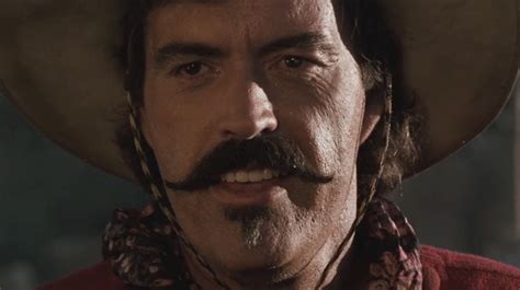 In Tombstone 1993 Powers Boothe Plays Curly Bill Brocius A Bumbling
