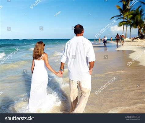 Romantic Loving Couple Walking On The Beach Caribbean Vacation Stock