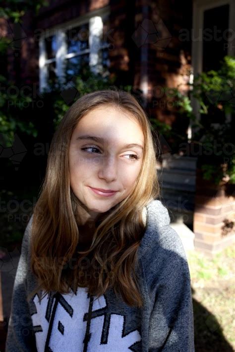 Image Of Pre Teen Girl Smiling In The Dappled Sunlight Austockphoto