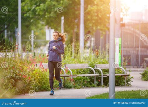 Fitness Woman Jogging In Park In The Sunny Morning Stock Photo Image