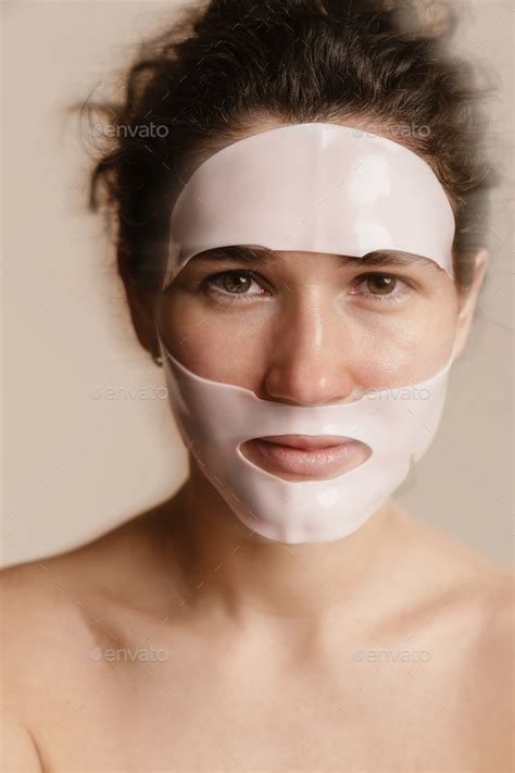 Half Naked Woman Looking At Camera While Posing In Facial Mask Stock Photo By Vadymvdrobot