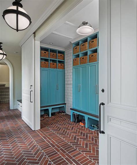 Since this is located in an open plan family room, the homeowners wanted the. Blue Mudroom Locker Cabinets with red Brick Herringbone ...