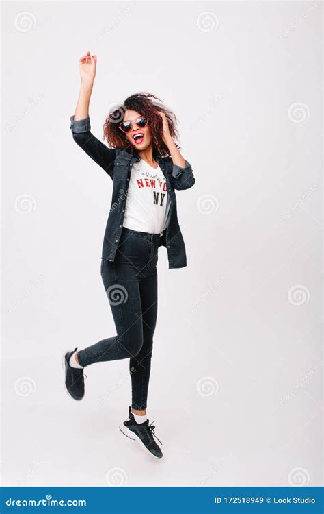 Full Length Portrait Of Cheerful Mulatto Girl In Stylish Sneakers And