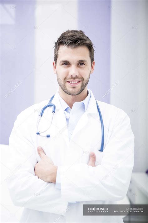 Portrait Of Smiling Doctor — Man Indoors Stock Photo 164883806