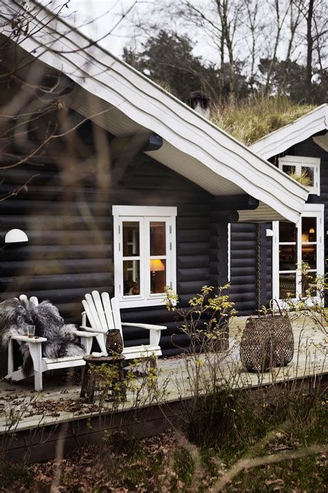 Black Stained Log Cabin In Danmark