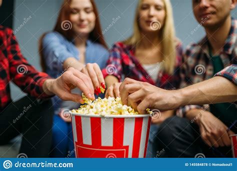 Group Of People Eating Popcorn In Cinema Stock Photo Image Of Dark