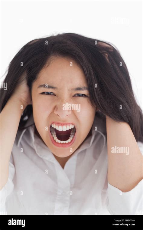 Screaming Brunette Pulling Her Hair On White Background Stock Photo Alamy