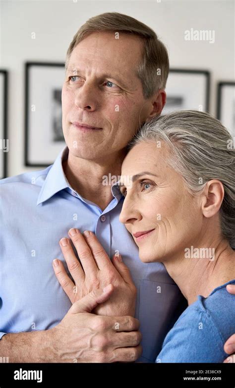 Mature Husband Embracing Smiling Middle Aged Wife Dreaming Of Good