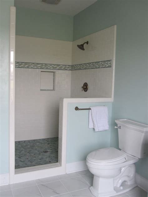 The plan is to have size 12x24 on floors and shower walls. Shower with pebble tile floor, white subway tile and glass ...