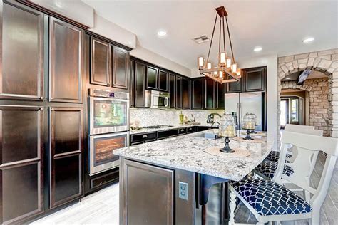 Granite countertop warehouse offers discounted granite and fabrication including granite slabs, backsplashes and design for kitchen and bathroom counters. White Ice Granite Countertops (Pictures, Cost, Pros and Cons)