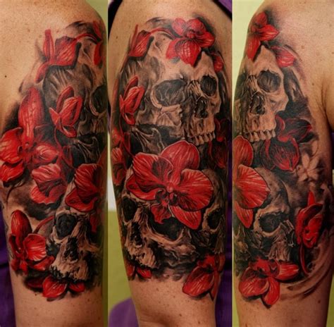Beautiful Red Orchids And Black Skulls Tattoo On Half Sleeve