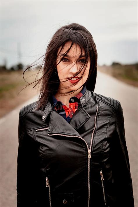 brunette woman with black leather jacket in a road stock image image of brunette person 87963997