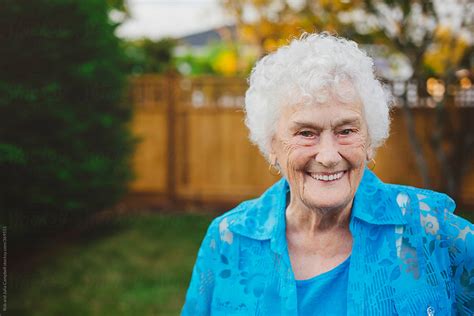 Happy Portrait Of Old Elderly Woman In Backyard By Stocksy