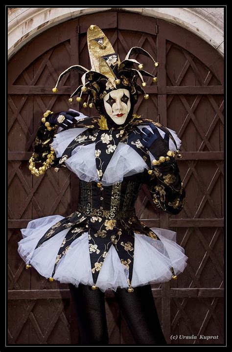 a court jester at carnival of venice 2012 wearing black gold and white ~ kuprat flickr