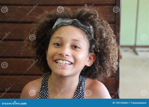 Multi Racial Tween Girl With Swim Goggles On Head Stock Photo Image