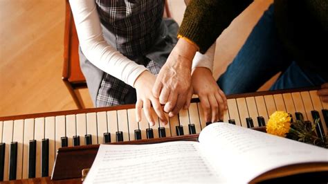 Premium Photo A Little Girl Playing Piano On Music Lesson A Teacher