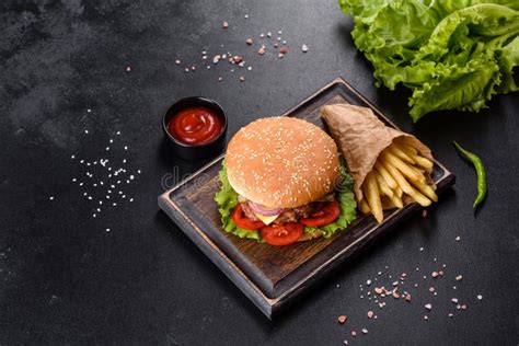 Craft Beef Burger And French Fries On A Black Background Stock Photo