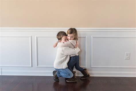 Brother And Sister Hugging By Stocksy Contributor Alison Winterroth