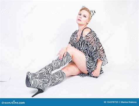 Attractive Pretty Woman Wearing Zebra Dress In Studio Stock Image