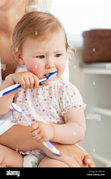Mother Taking Care Of Her Beautiful Child Stock Photo Alamy