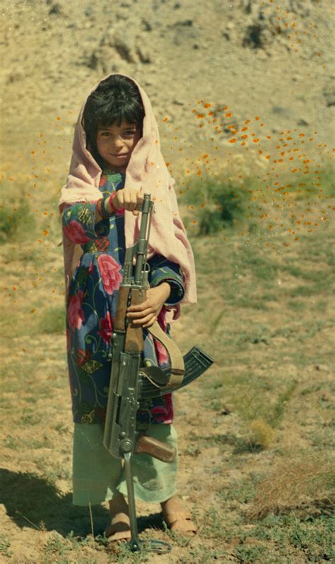 A Young Girl With A Machine Gun Posing For Camera Free Free Download