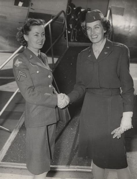 Q49360 Member Of The Womens Army Corps Shaking Hands With A Member