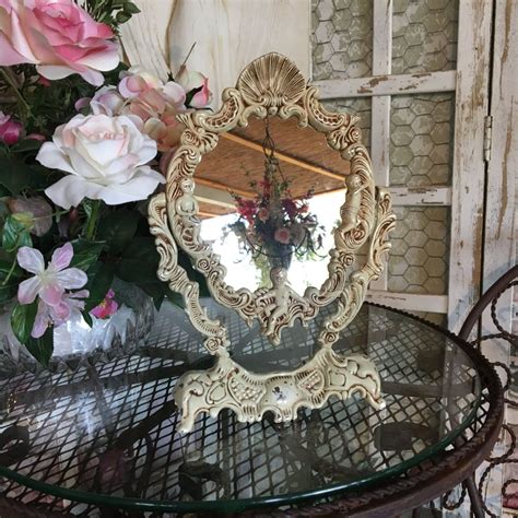 A stool has a square grey covered seat and. Vintage Free Standing Vanity Mirror with Cherubs, Swivel ...