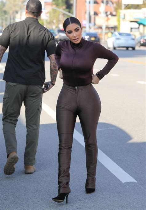 kim kardashian turns heads in ultra tight brown disco pants at sap and honey