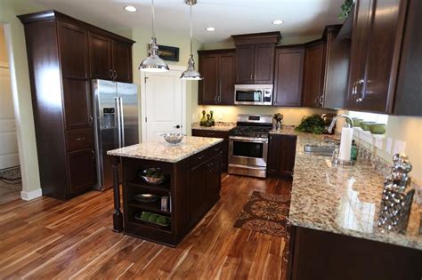 Black kitchen cabinets are an uncomplicated if you have a small space for your kitchen, don't worry about dark cabinets taking the light out of the room! 25 Kitchens With Hardwood Floors - Page 2 of 5