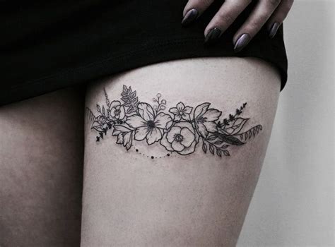 A Womans Thigh With Flowers And Leaves Tattoo On Her Left Side Ribcage
