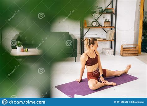 Muscular Young Woman With Perfect Athletic Body Watching Online Stream
