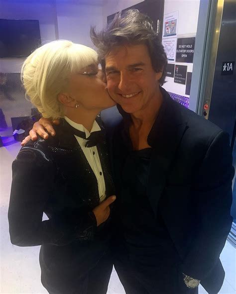 Lady Gaga Plants A Kiss On Tom Cruise As He Supports Her At Concert
