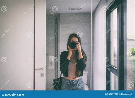 Selfie Self Portrait Woman Taking Picture With Professional Slr Camera At Home Bathroom Mirror