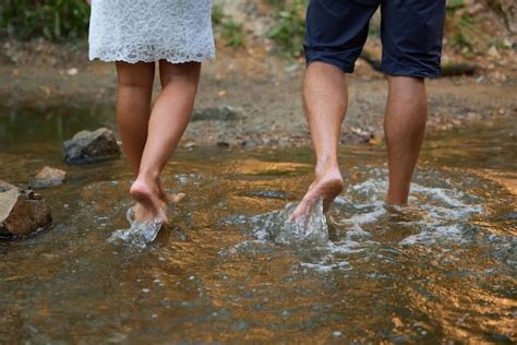 Premium Photo Couple In Love Walking Barefoot On The Water
