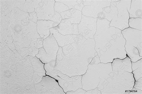 Cracked Flaking White Paint On The Wall Background Texture Stock