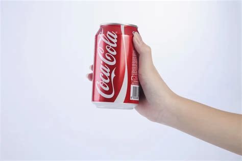 Hand Holding Coca Cola Stock Editorial Photo © Eskaylim 93192506