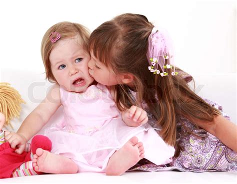 Kids Giving A Kiss To Each Other Stock Image Colourbox