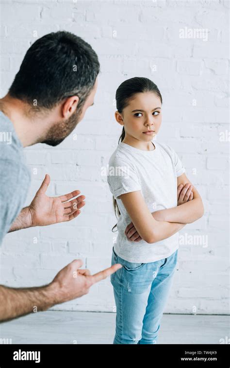 Bearded Father Scolding Sad Preteen Daughter At Home Stock Photo Alamy
