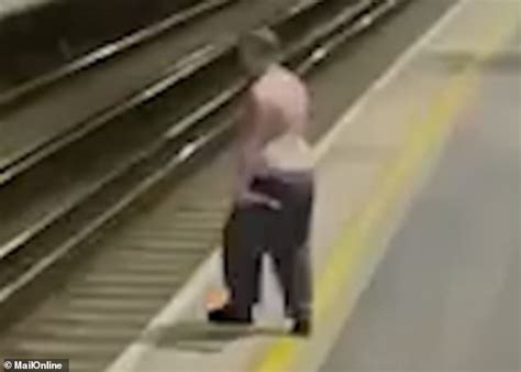 Heart Stopping Moment Drunk Man Stumbles Onto Railway Tracks Daily Mail Online
