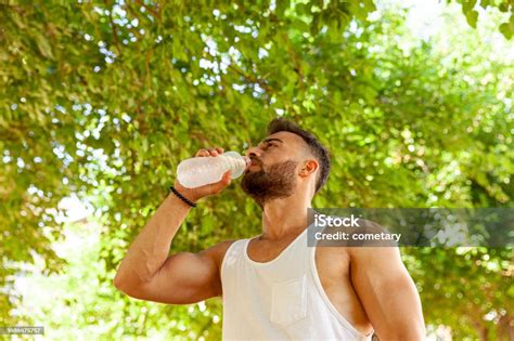 Young Man Drinking Water Stock Photo Download Image Now Active