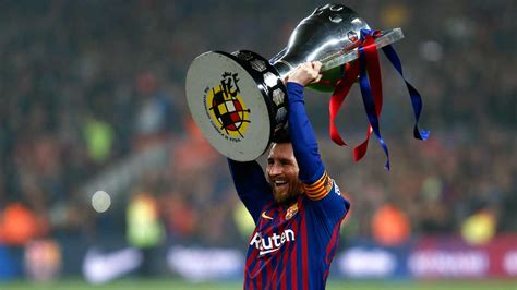 A barca fan outside the gates of camp nou crying while holding a messi jersey. Messi fires Barca to eighth La Liga title in 11 years ...