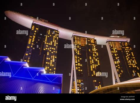 Skyline Of Singapore Marina Bay At Night With Luxury Marina Bay Sands