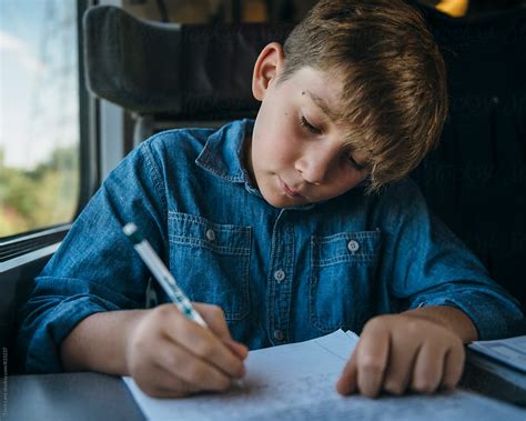 Young Boy Writing A Letter While Travelling In Train by Trent Lanz - Homeschool, Child