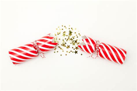 Premium Photo Pulled Christmas Cracker On A White Background Crackers