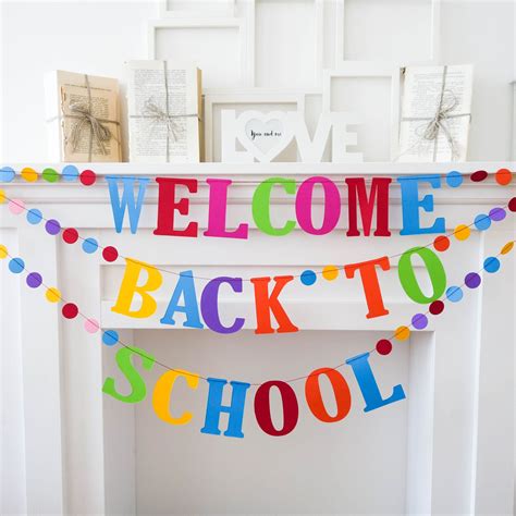 A Welcome Back To School Banner Hanging From A Fireplace Mantel In