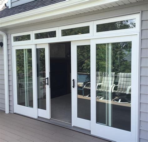 Finishing Up This Beautiful Wide Andersen E Series Sliding French Door With Transom Today