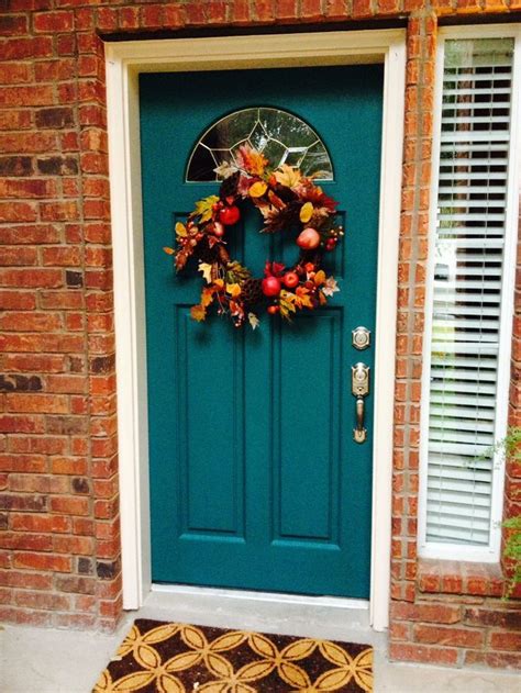 Could be right beside your front door. Teal painted front door with red bricks -- the first thing ...